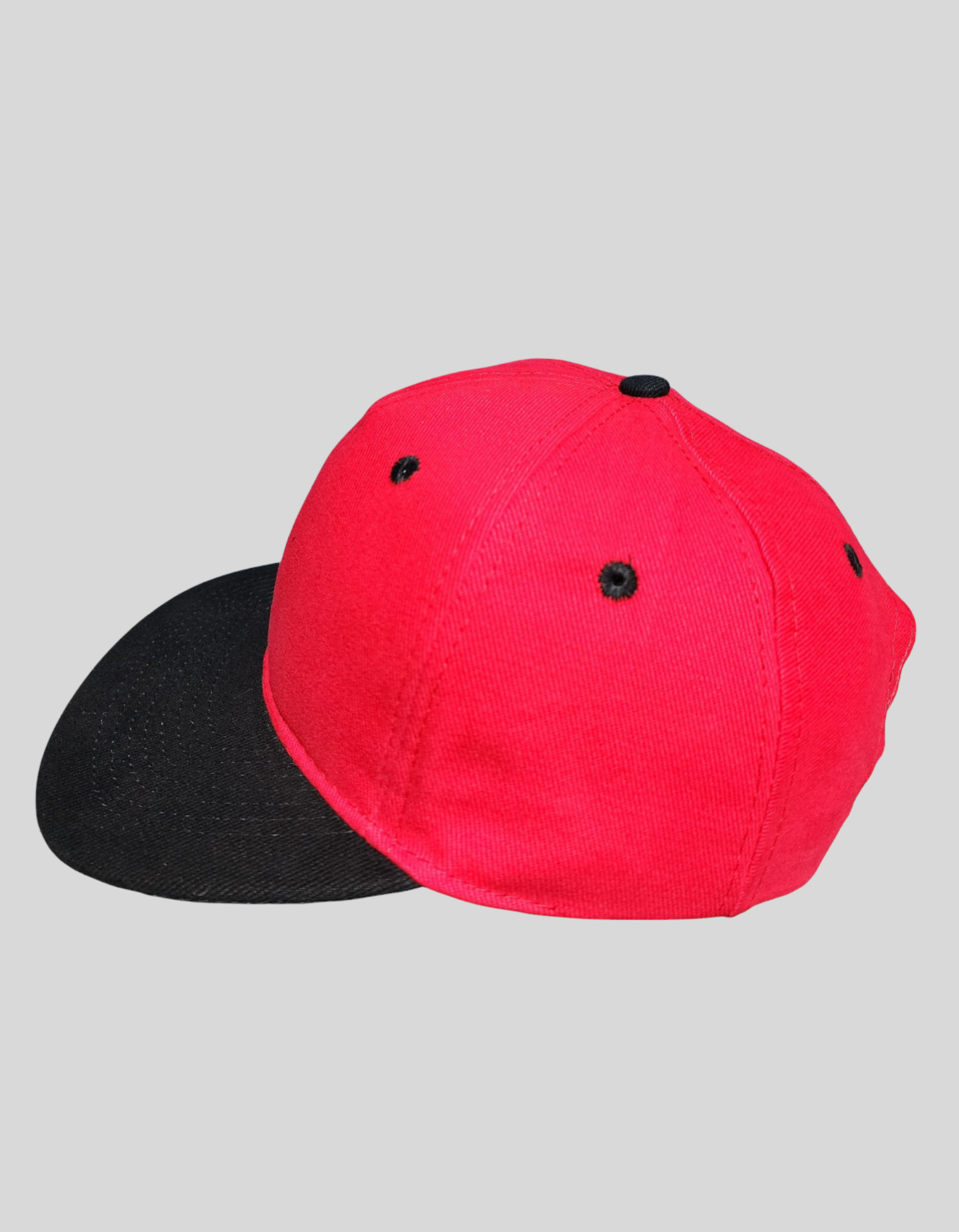 Red and black flat brim cap made of durable cotton with adjustable snapback closure