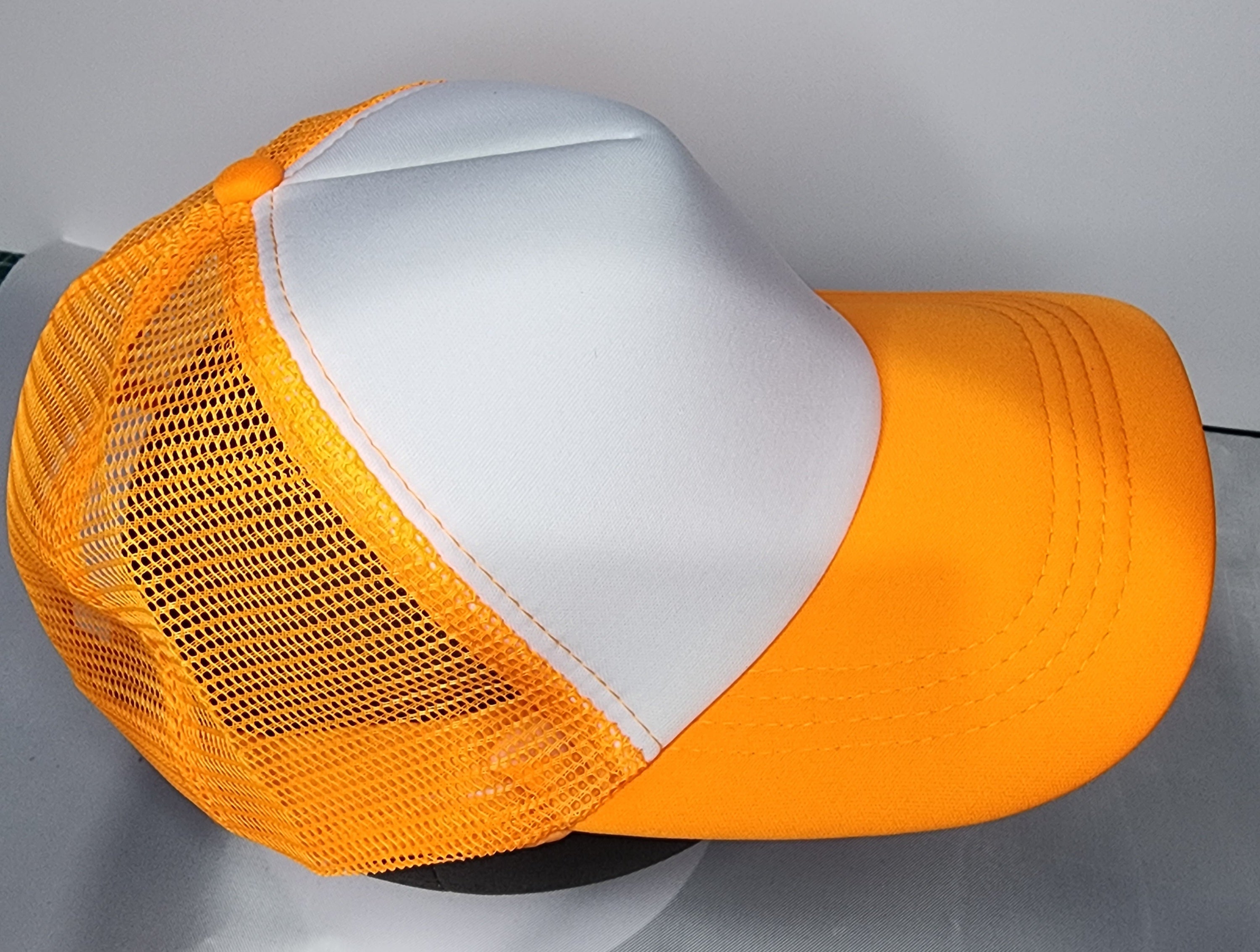 Side view of trucker mesh cap showing breathable foam panel