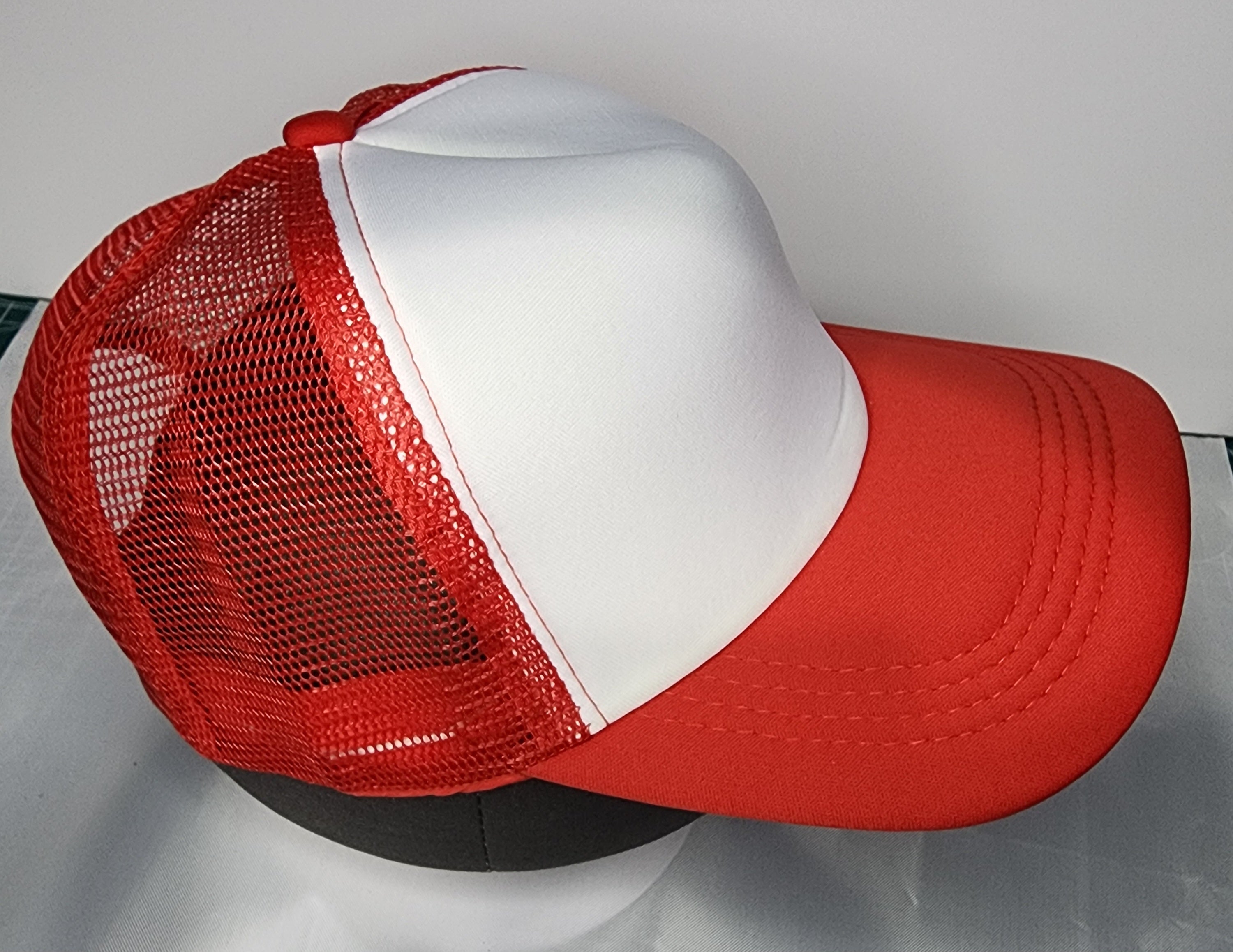 Embroidered logo on white front panel of poly foam trucker cap
