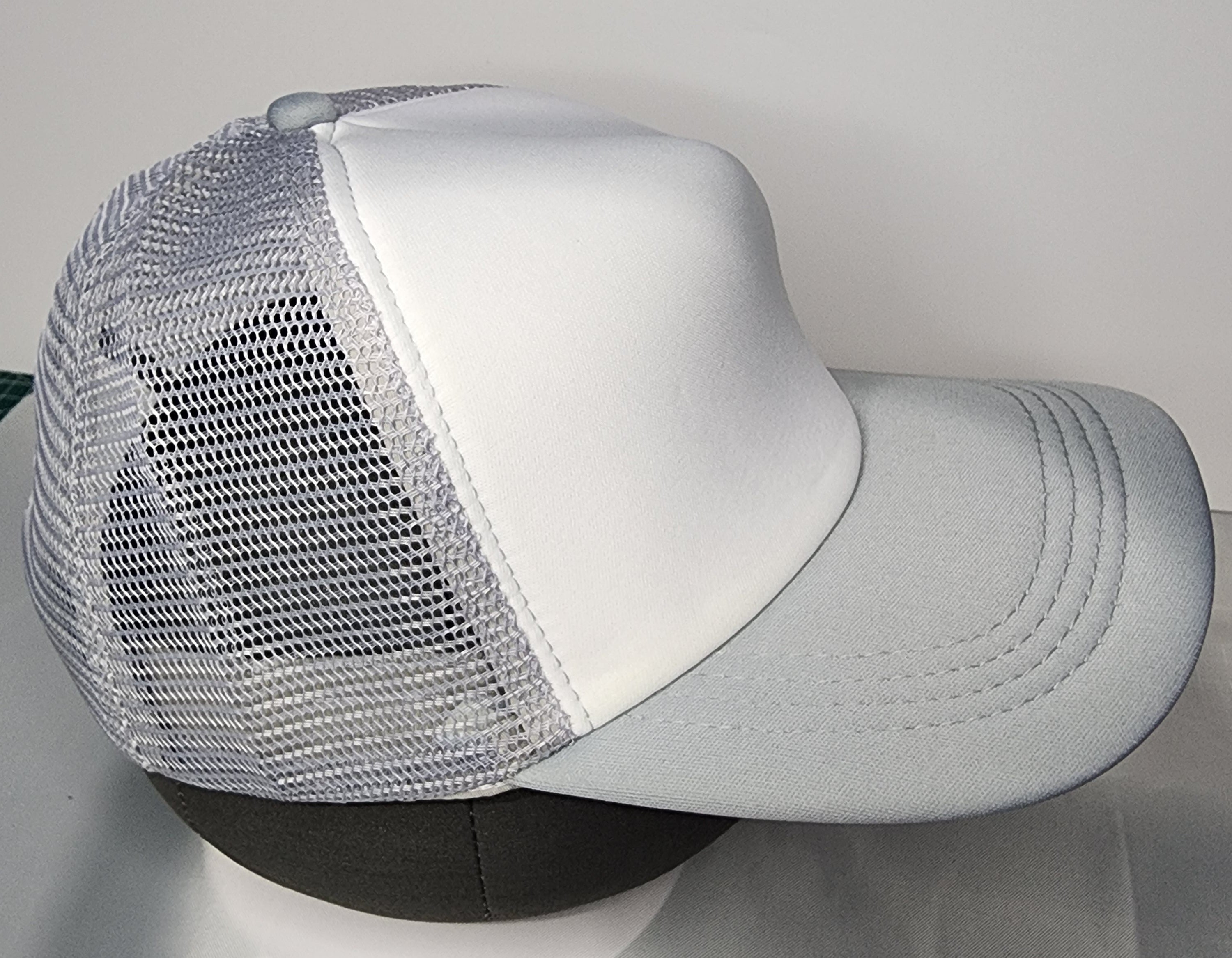 Blank trucker mesh caps ready for embroidery or UV DTF printing