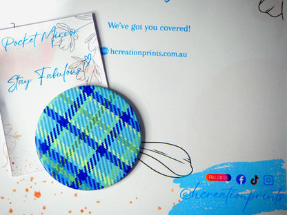 Compact pocket mirror with blue and green plaid design for travel and daily use